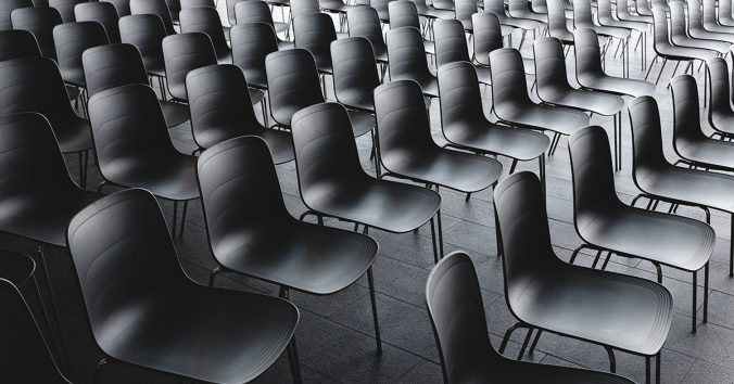 Empty rows of chairs in conference room