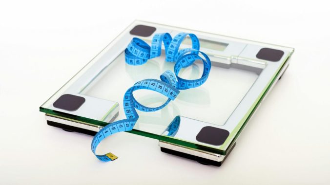 Scale & measuring tape. Photo by Pixabay: https://www.pexels.com/photo/blue-tape-measuring-on-clear-glass-square-weighing-scale-53404/