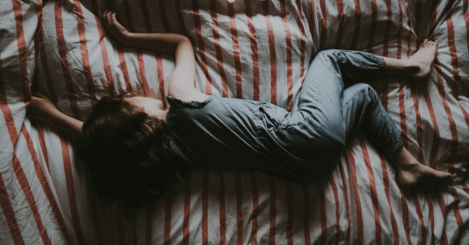 Child sleeping on bed. Photo by Annie Spratt, Unsplash