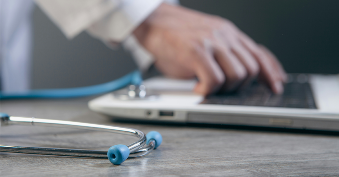 physician at computer
